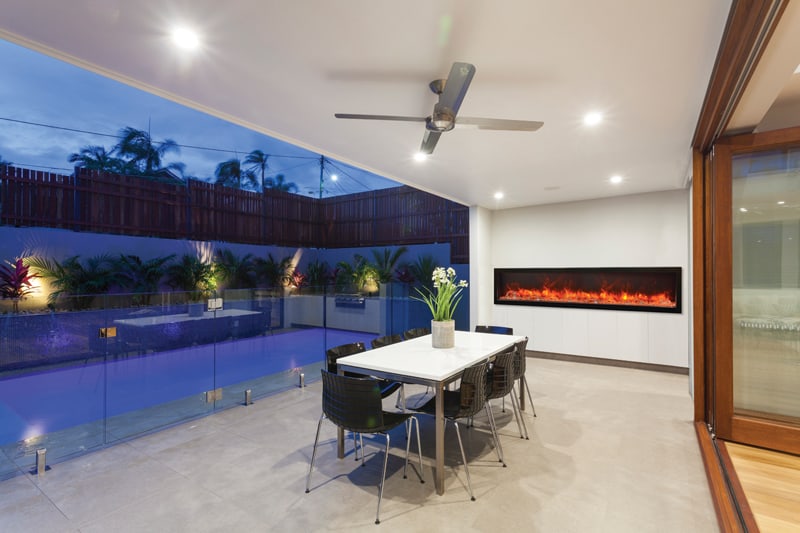 Amantii 88" Panorama Slim Indoor or Outdoor Electric Fireplace -BI-88-SLIM-OD- Lifestyle Patio With Pool 