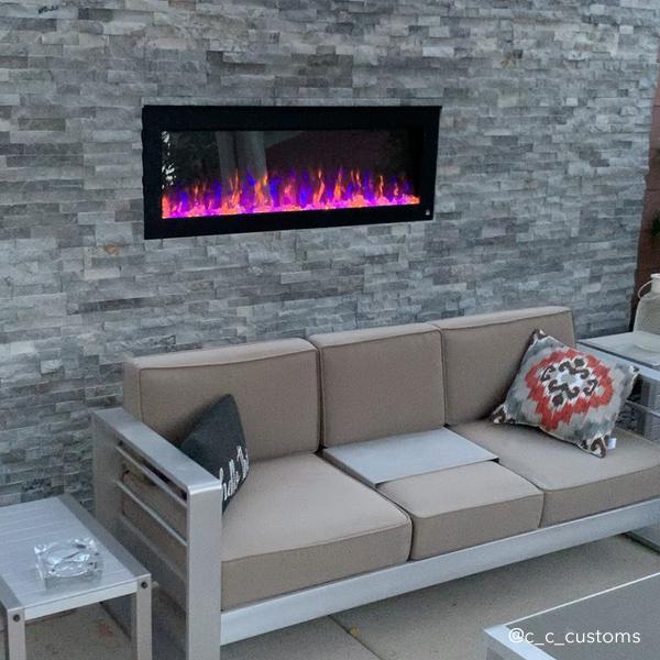 Touchstone -The Sideline Outdoor/Indoor 50" Recessed/Wall Mounted Electric Fireplace (No Heat)-80017- Lifestyle With Gray Stone Wall